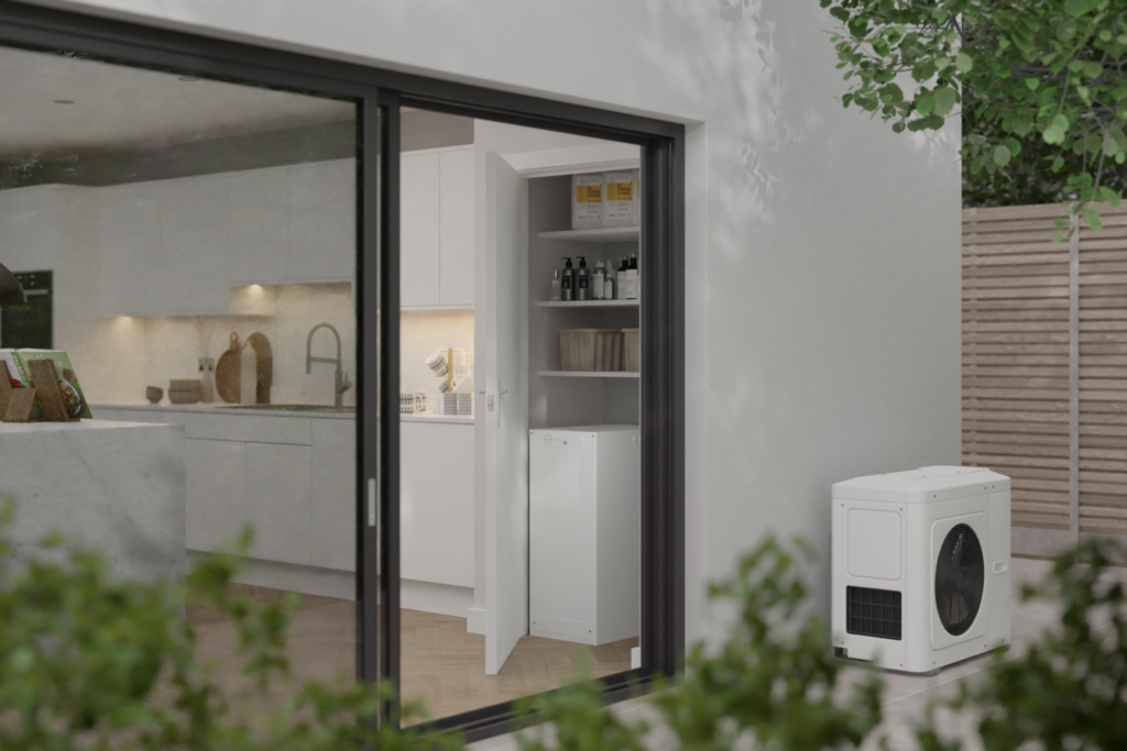 External shot of house with heat pump. A Thermino is visible through bifold doors in the kitchen